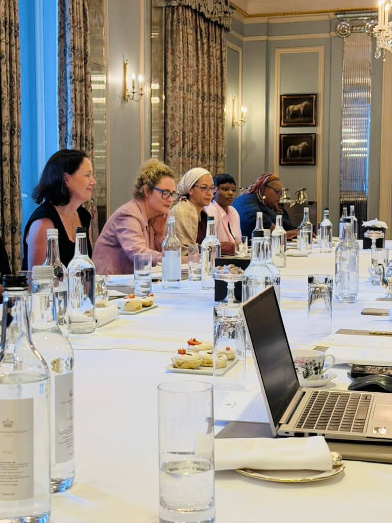 Senior women leaders in discussion around a long table during the CWS AI London edition